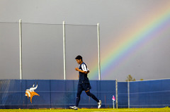 west valley college soccer player warming up under a rainbow.