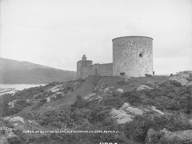 photo of a stone tower on a rocky coast.
