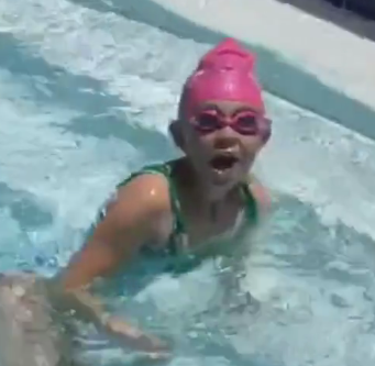 screenshot of little girl swimming